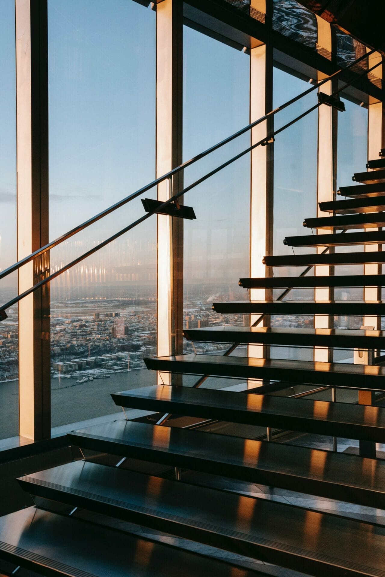 Office building staircase with window view of city