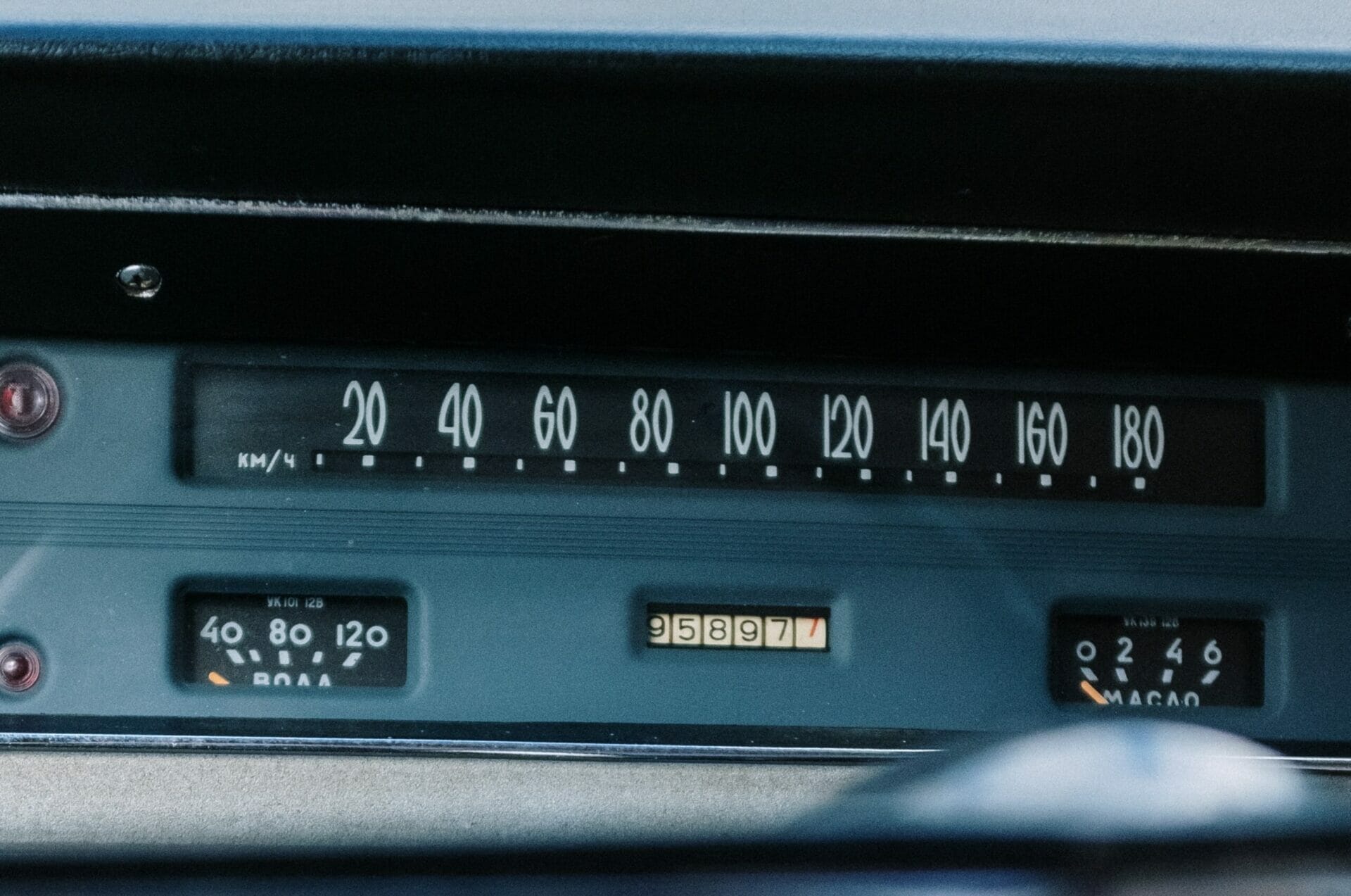 Analogue car dashboard displaying accelerator